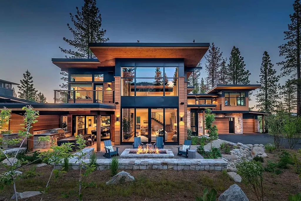 9601 Dunsmuir Way Home in Truckee, California. Immerse yourself in the tranquility of this exquisite Martis Camp home, boasting panoramic mountain views and luxurious amenities. Wake up to breathtaking sunrises, enjoy the open great room with its stunning architecture, and indulge in the state-of-the-art kitchen and spacious living areas. With five bedrooms, a hot tub patio, and proximity to skiing and tennis facilities, this retreat offers a perfect balance of serenity and convenience. Experience mountain living at its finest in this stylishly designed home nestled amidst the natural beauty of Martis Camp.