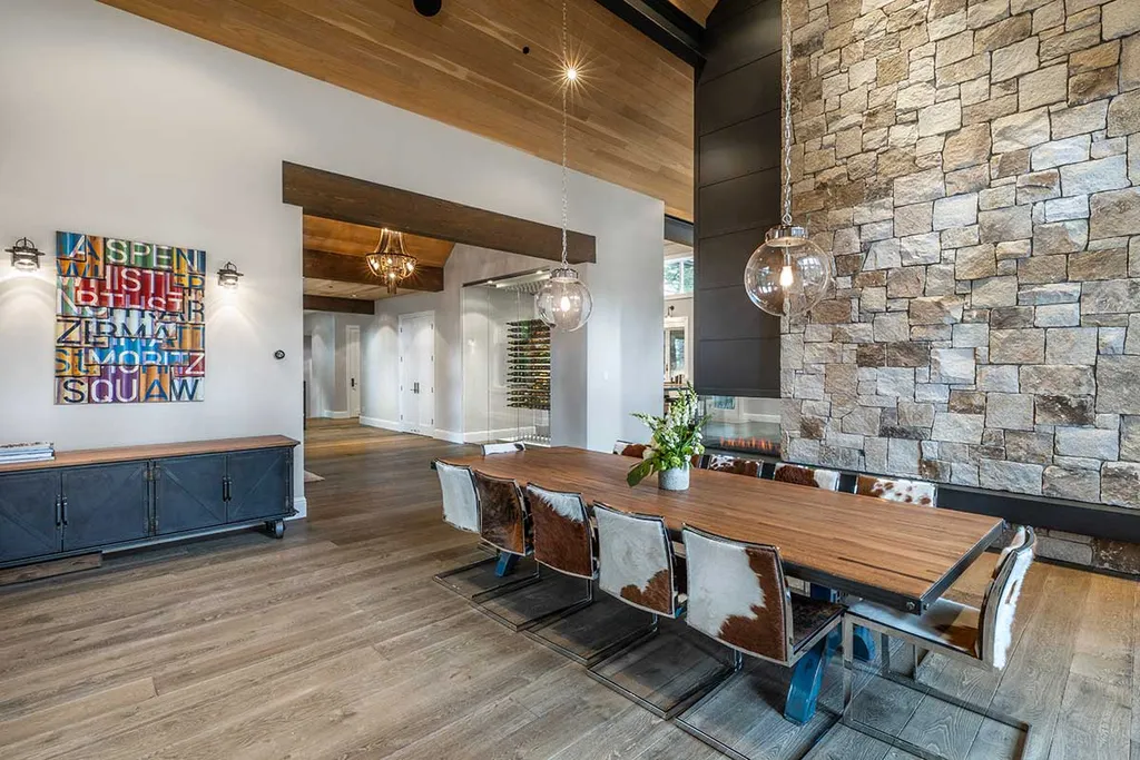 9661 Dunsmuir Way Home in Truckee, California. Prepare to be captivated as you step through the front door of this extraordinary 7,546-square-foot modern mountain home in Martis Camp. The first glimpse is nothing short of awe-inspiring—a vast expanse of glass that serves as both a wall and a stunning 288-bottle wine cellar. This artistic flair extends throughout the 6-bedroom, 7-bathroom residence, creating a truly unique and rewarding living experience.