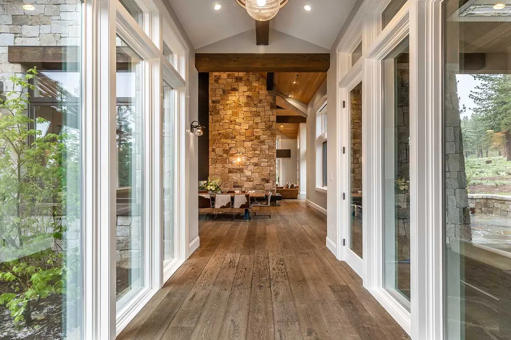 9661 Dunsmuir Way Home in Truckee, California. Prepare to be captivated as you step through the front door of this extraordinary 7,546-square-foot modern mountain home in Martis Camp. The first glimpse is nothing short of awe-inspiring—a vast expanse of glass that serves as both a wall and a stunning 288-bottle wine cellar. This artistic flair extends throughout the 6-bedroom, 7-bathroom residence, creating a truly unique and rewarding living experience.