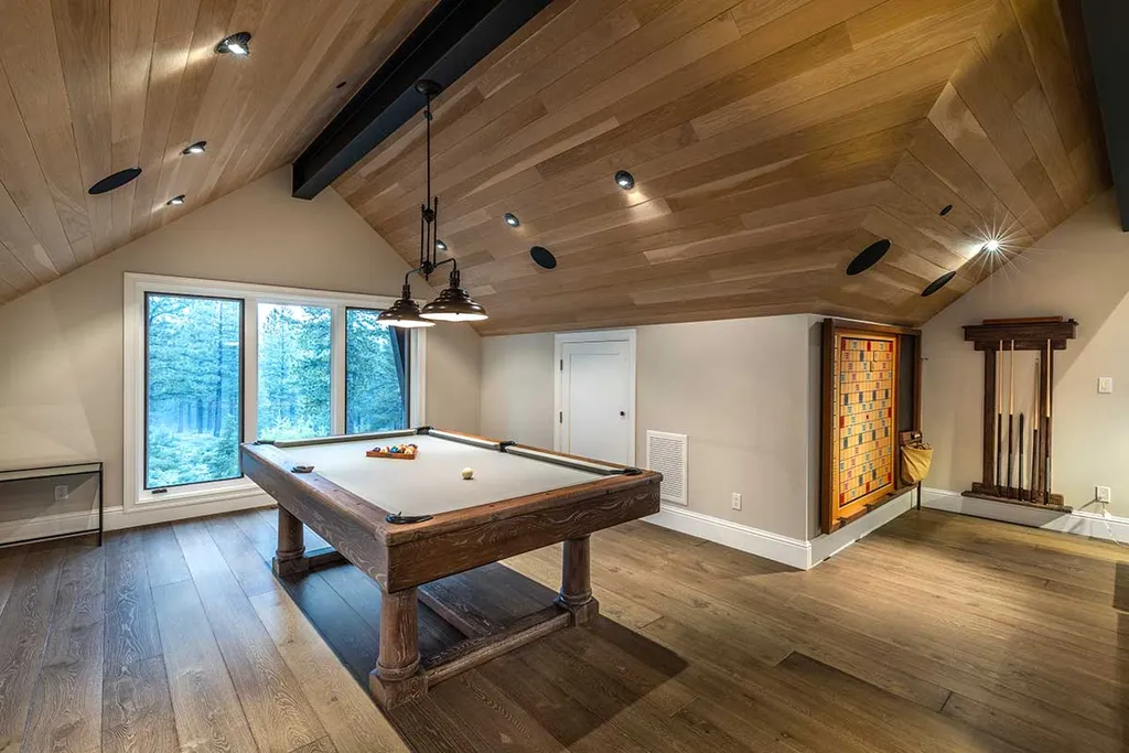 9661 Dunsmuir Way Home in Truckee, California. Prepare to be captivated as you step through the front door of this extraordinary 7,546-square-foot modern mountain home in Martis Camp. The first glimpse is nothing short of awe-inspiring—a vast expanse of glass that serves as both a wall and a stunning 288-bottle wine cellar. This artistic flair extends throughout the 6-bedroom, 7-bathroom residence, creating a truly unique and rewarding living experience.