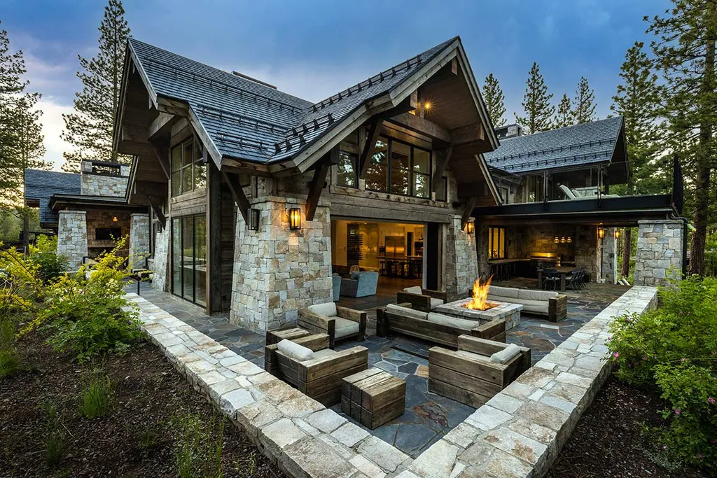 9661 Dunsmuir Way Home in Truckee, California. Prepare to be captivated as you step through the front door of this extraordinary 7,546-square-foot modern mountain home in Martis Camp. The first glimpse is nothing short of awe-inspiring—a vast expanse of glass that serves as both a wall and a stunning 288-bottle wine cellar. This artistic flair extends throughout the 6-bedroom, 7-bathroom residence, creating a truly unique and rewarding living experience.