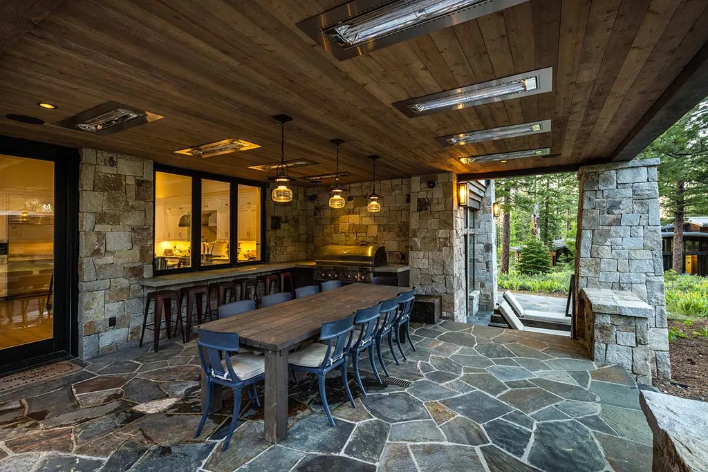 9661 Dunsmuir Way Home in Truckee, California. Prepare to be captivated as you step through the front door of this extraordinary 7,546-square-foot modern mountain home in Martis Camp. The first glimpse is nothing short of awe-inspiring—a vast expanse of glass that serves as both a wall and a stunning 288-bottle wine cellar. This artistic flair extends throughout the 6-bedroom, 7-bathroom residence, creating a truly unique and rewarding living experience.