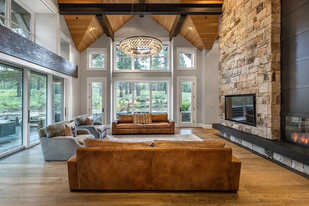9661 Dunsmuir Way Home in Truckee, California. Prepare to be captivated as you step through the front door of this extraordinary 7,546-square-foot modern mountain home in Martis Camp. The first glimpse is nothing short of awe-inspiring—a vast expanse of glass that serves as both a wall and a stunning 288-bottle wine cellar. This artistic flair extends throughout the 6-bedroom, 7-bathroom residence, creating a truly unique and rewarding living experience.