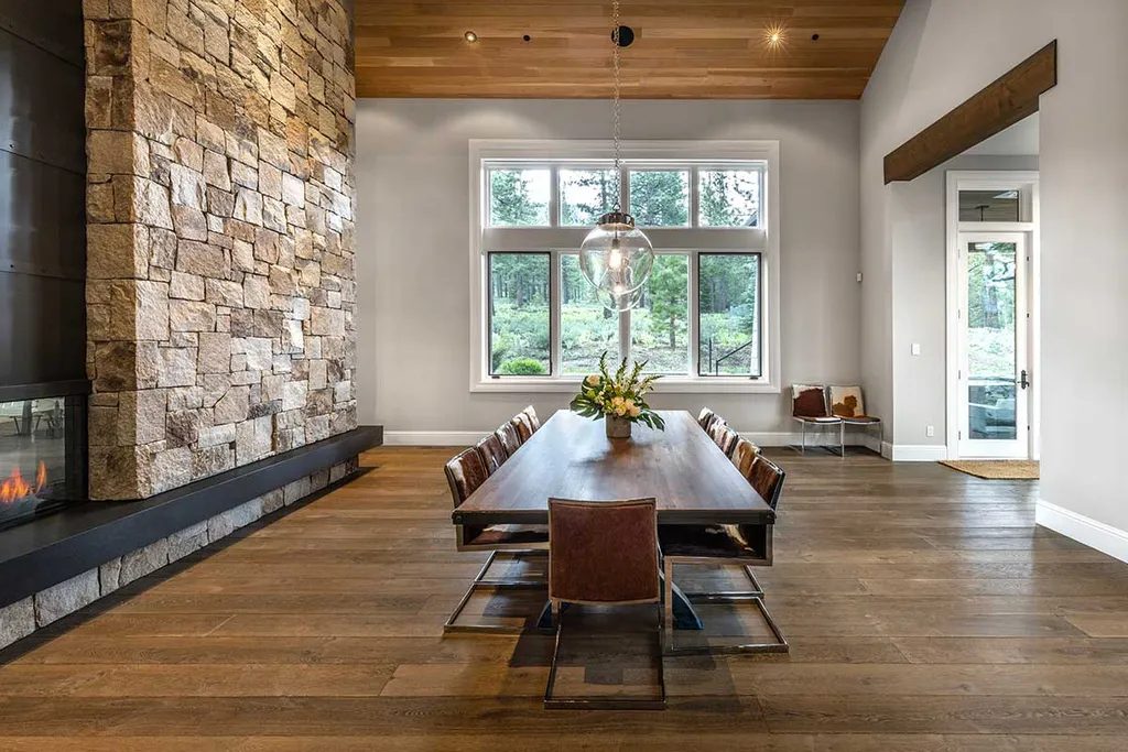 9661 Dunsmuir Way Home in Truckee, California. Prepare to be captivated as you step through the front door of this extraordinary 7,546-square-foot modern mountain home in Martis Camp. The first glimpse is nothing short of awe-inspiring—a vast expanse of glass that serves as both a wall and a stunning 288-bottle wine cellar. This artistic flair extends throughout the 6-bedroom, 7-bathroom residence, creating a truly unique and rewarding living experience.