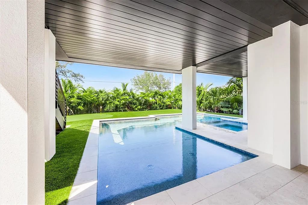 Experience luxury coastal living at 117 N Bay Boulevard, Anna Maria, Florida. This 4-bedrooms, 5-bathrooms, 3,155 square feet bayfront estate is a masterpiece of elegance.