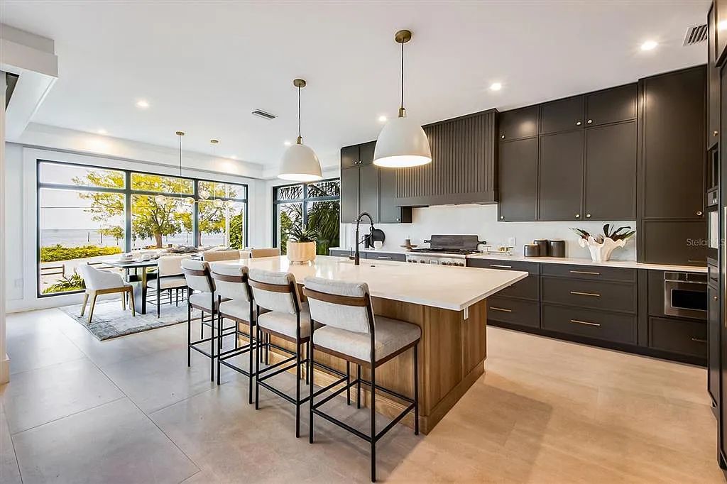 Experience luxury coastal living at 117 N Bay Boulevard, Anna Maria, Florida. This 4-bedrooms, 5-bathrooms, 3,155 square feet bayfront estate is a masterpiece of elegance.