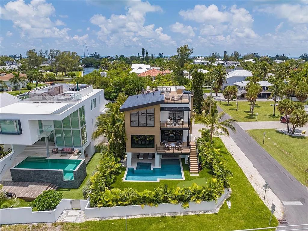Experience luxury coastal living at 117 N Bay Boulevard, Anna Maria, Florida. This 4-bedrooms, 5-bathrooms, 3,155 square feet bayfront estate is a masterpiece of elegance.