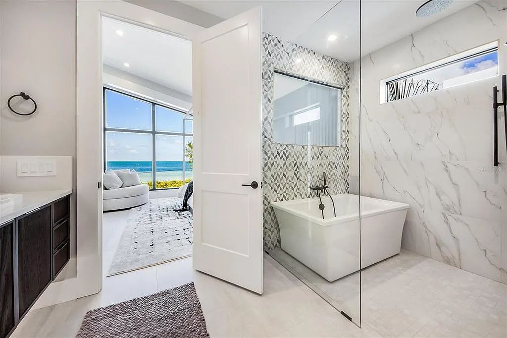 Experience luxury coastal living at 117 N Bay Boulevard, Anna Maria, Florida. This 4-bedrooms, 5-bathrooms, 3,155 square feet bayfront estate is a masterpiece of elegance.
