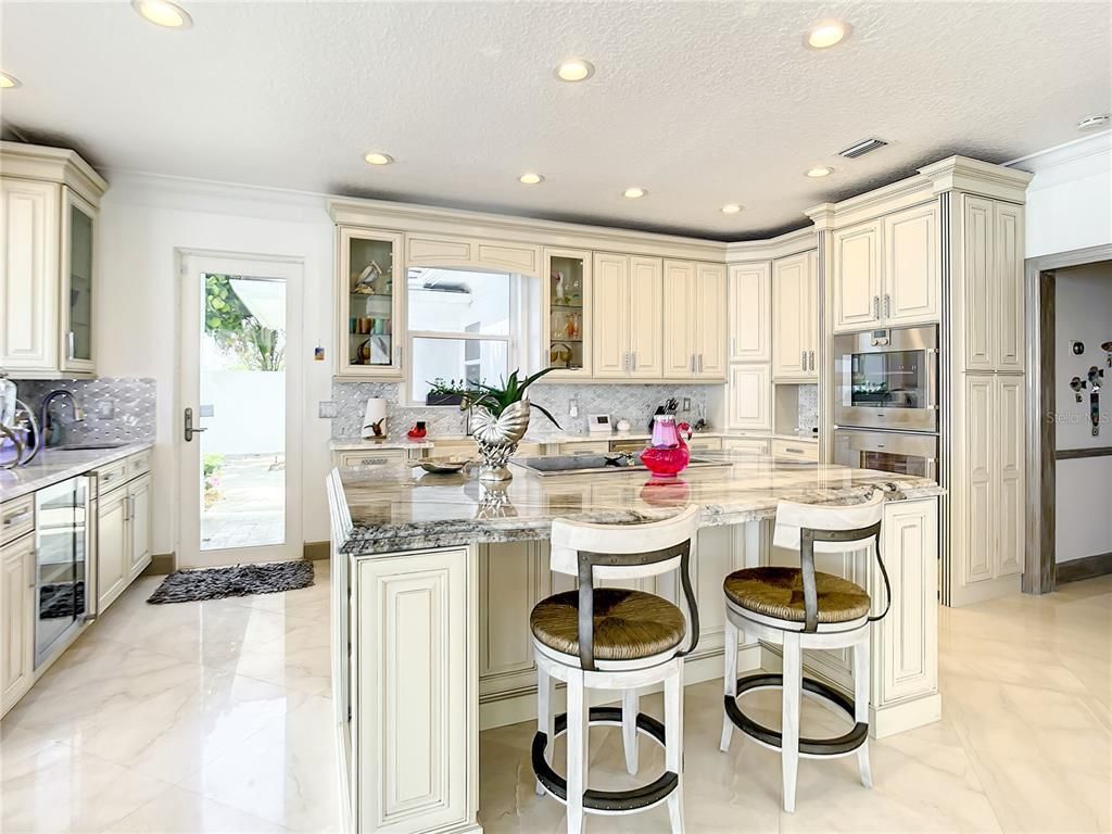 Welcome to 4031 S Atlantic Avenue in Port Orange, Florida - an exquisite beachfront property boasting breathtaking ocean views and a fully renovated design. This gated home offers over 5,300 square feet of living space, featuring 6 bedrooms, 5.5 bathrooms, and an attached in-law suite.