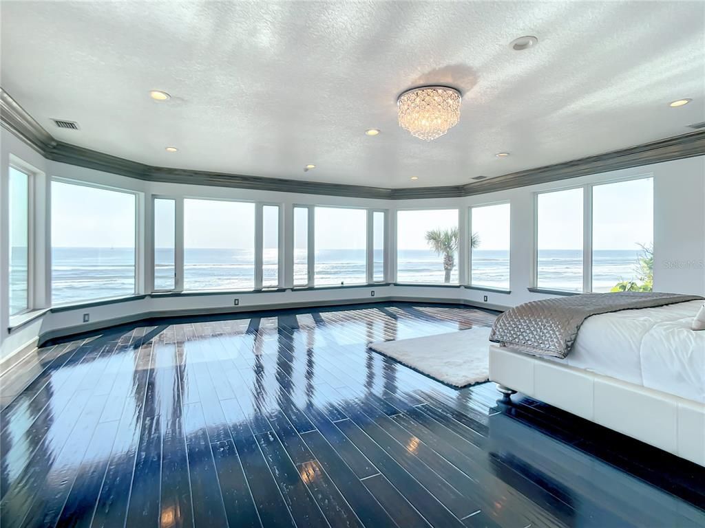 Welcome to 4031 S Atlantic Avenue in Port Orange, Florida - an exquisite beachfront property boasting breathtaking ocean views and a fully renovated design. This gated home offers over 5,300 square feet of living space, featuring 6 bedrooms, 5.5 bathrooms, and an attached in-law suite.