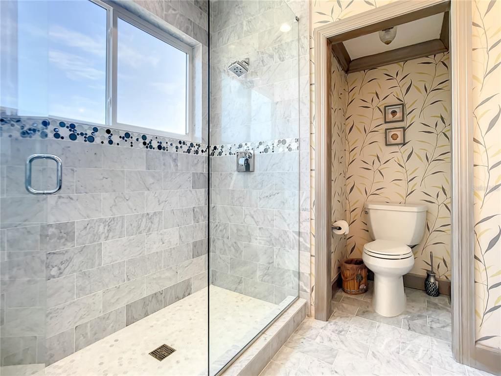 Welcome to 4031 S Atlantic Avenue in Port Orange, Florida - an exquisite beachfront property boasting breathtaking ocean views and a fully renovated design. This gated home offers over 5,300 square feet of living space, featuring 6 bedrooms, 5.5 bathrooms, and an attached in-law suite.