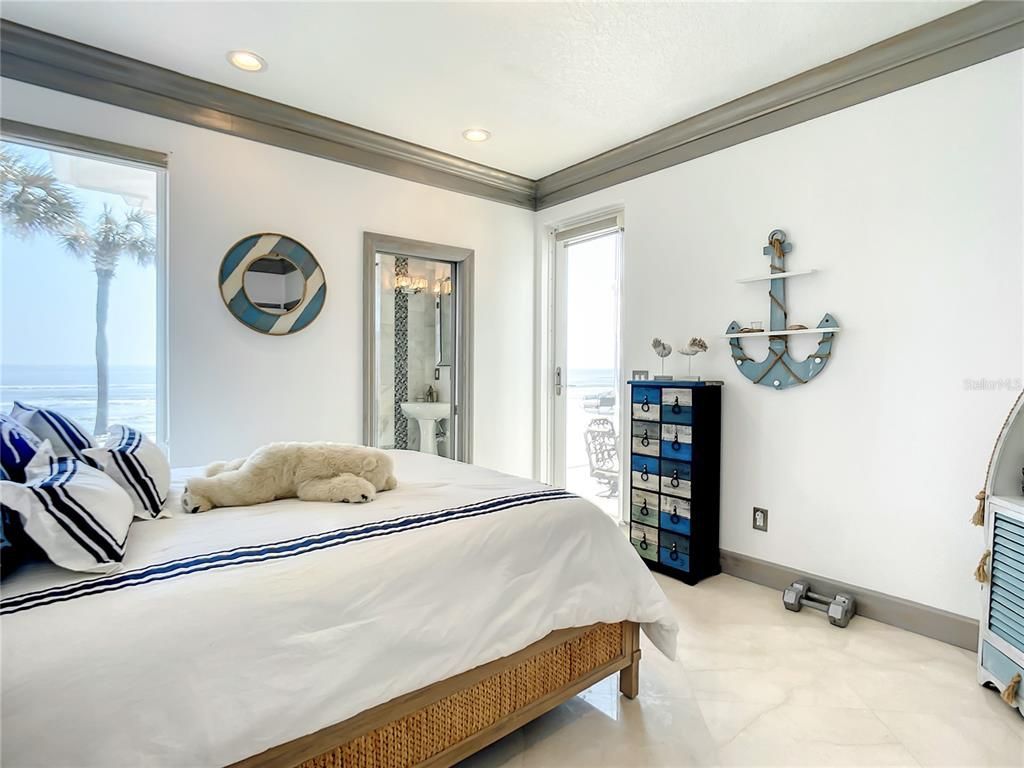 Welcome to 4031 S Atlantic Avenue in Port Orange, Florida - an exquisite beachfront property boasting breathtaking ocean views and a fully renovated design. This gated home offers over 5,300 square feet of living space, featuring 6 bedrooms, 5.5 bathrooms, and an attached in-law suite.