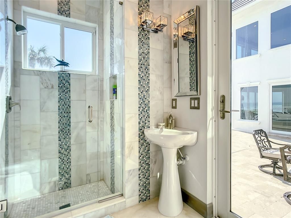 Welcome to 4031 S Atlantic Avenue in Port Orange, Florida - an exquisite beachfront property boasting breathtaking ocean views and a fully renovated design. This gated home offers over 5,300 square feet of living space, featuring 6 bedrooms, 5.5 bathrooms, and an attached in-law suite.