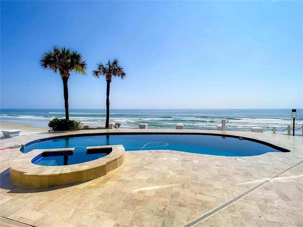 Welcome to 4031 S Atlantic Avenue in Port Orange, Florida - an exquisite beachfront property boasting breathtaking ocean views and a fully renovated design. This gated home offers over 5,300 square feet of living space, featuring 6 bedrooms, 5.5 bathrooms, and an attached in-law suite.