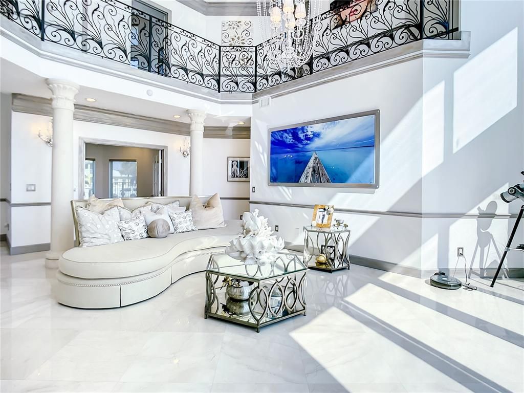Welcome to 4031 S Atlantic Avenue in Port Orange, Florida - an exquisite beachfront property boasting breathtaking ocean views and a fully renovated design. This gated home offers over 5,300 square feet of living space, featuring 6 bedrooms, 5.5 bathrooms, and an attached in-law suite.