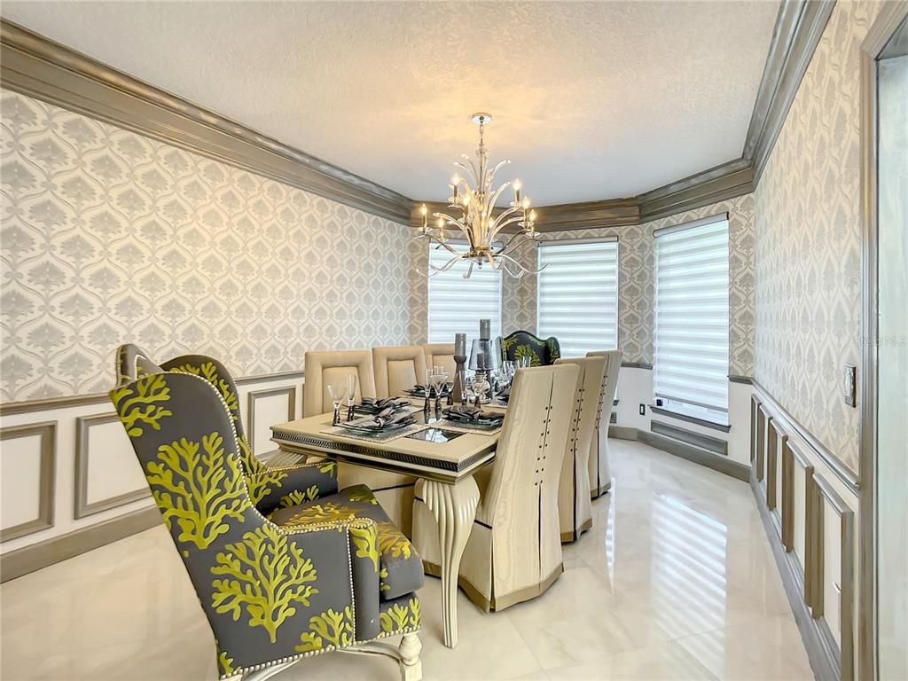 Welcome to 4031 S Atlantic Avenue in Port Orange, Florida - an exquisite beachfront property boasting breathtaking ocean views and a fully renovated design. This gated home offers over 5,300 square feet of living space, featuring 6 bedrooms, 5.5 bathrooms, and an attached in-law suite.