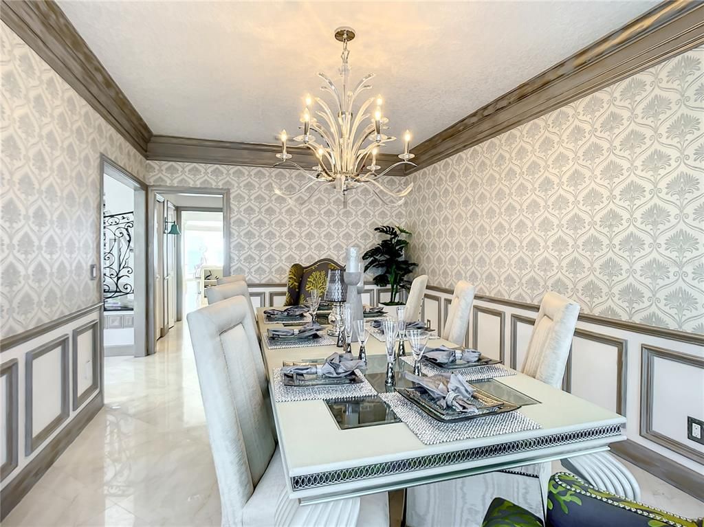 Welcome to 4031 S Atlantic Avenue in Port Orange, Florida - an exquisite beachfront property boasting breathtaking ocean views and a fully renovated design. This gated home offers over 5,300 square feet of living space, featuring 6 bedrooms, 5.5 bathrooms, and an attached in-law suite.