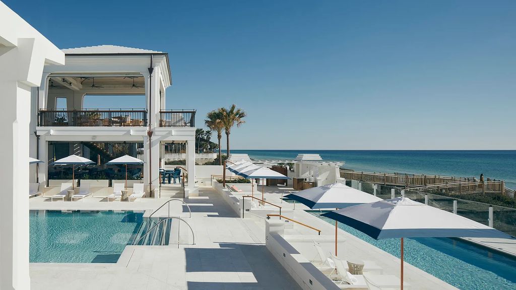 Discover modern living at its finest with this exquisite property at 62 S Charles Street, Inlet Beach, Florida. Built by Boheme Design in 2019, this architectural masterpiece offers 4 beds, 5 baths, and 3,845 sq ft of luxurious living space. Enjoy the peacefulness of Palmera Park and stunning outdoor areas, including a pool with a mesmerizing 32' water wall. Dual primary suites, a gourmet kitchen, and a media room with a wet bar elevate the living experience. Embrace the elegance, convenience, and serenity of this must-see home, complete with access to a private Beach Club.
