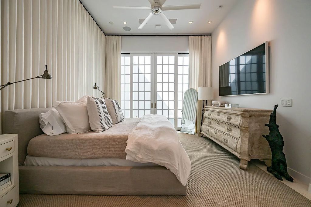 Discover modern living at its finest with this exquisite property at 62 S Charles Street, Inlet Beach, Florida. Built by Boheme Design in 2019, this architectural masterpiece offers 4 beds, 5 baths, and 3,845 sq ft of luxurious living space. Enjoy the peacefulness of Palmera Park and stunning outdoor areas, including a pool with a mesmerizing 32' water wall. Dual primary suites, a gourmet kitchen, and a media room with a wet bar elevate the living experience. Embrace the elegance, convenience, and serenity of this must-see home, complete with access to a private Beach Club.