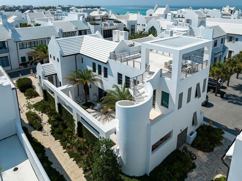Discover modern living at its finest with this exquisite property at 62 S Charles Street, Inlet Beach, Florida. Built by Boheme Design in 2019, this architectural masterpiece offers 4 beds, 5 baths, and 3,845 sq ft of luxurious living space. Enjoy the peacefulness of Palmera Park and stunning outdoor areas, including a pool with a mesmerizing 32' water wall. Dual primary suites, a gourmet kitchen, and a media room with a wet bar elevate the living experience. Embrace the elegance, convenience, and serenity of this must-see home, complete with access to a private Beach Club.