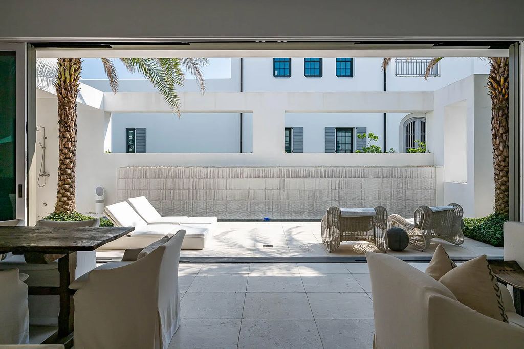 Discover modern living at its finest with this exquisite property at 62 S Charles Street, Inlet Beach, Florida. Built by Boheme Design in 2019, this architectural masterpiece offers 4 beds, 5 baths, and 3,845 sq ft of luxurious living space. Enjoy the peacefulness of Palmera Park and stunning outdoor areas, including a pool with a mesmerizing 32' water wall. Dual primary suites, a gourmet kitchen, and a media room with a wet bar elevate the living experience. Embrace the elegance, convenience, and serenity of this must-see home, complete with access to a private Beach Club.