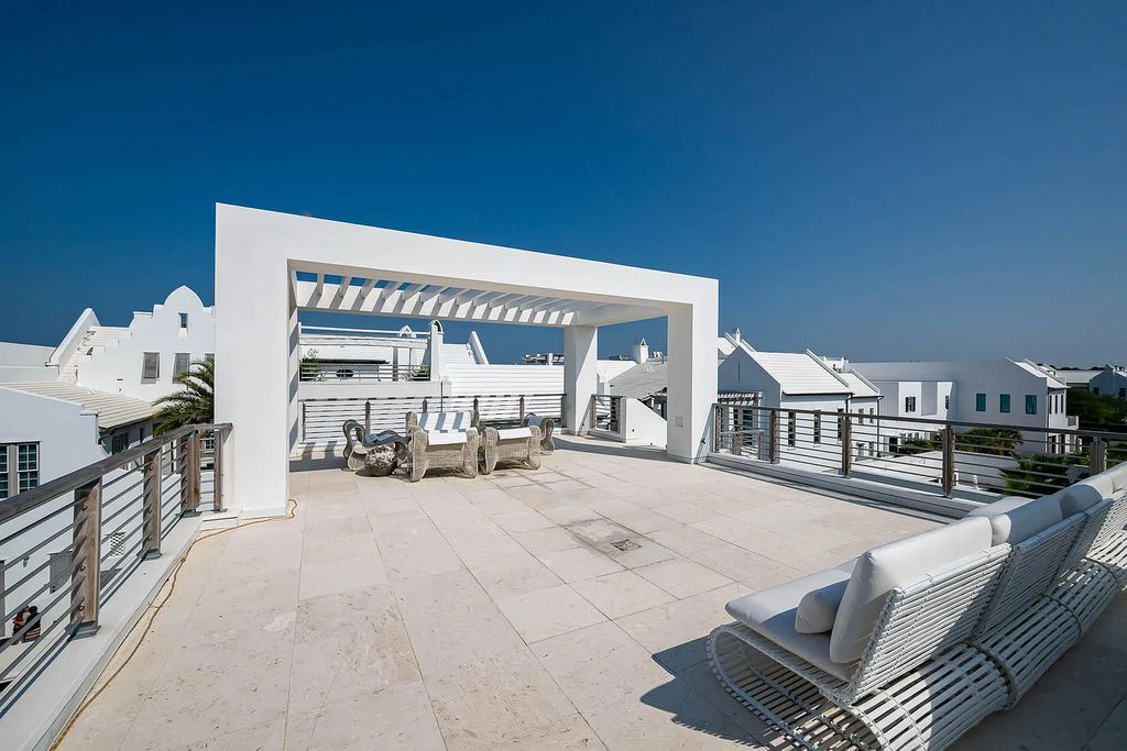 Discover modern living at its finest with this exquisite property at 62 S Charles Street, Inlet Beach, Florida. Built by Boheme Design in 2019, this architectural masterpiece offers 4 beds, 5 baths, and 3,845 sq ft of luxurious living space. Enjoy the peacefulness of Palmera Park and stunning outdoor areas, including a pool with a mesmerizing 32' water wall. Dual primary suites, a gourmet kitchen, and a media room with a wet bar elevate the living experience. Embrace the elegance, convenience, and serenity of this must-see home, complete with access to a private Beach Club.