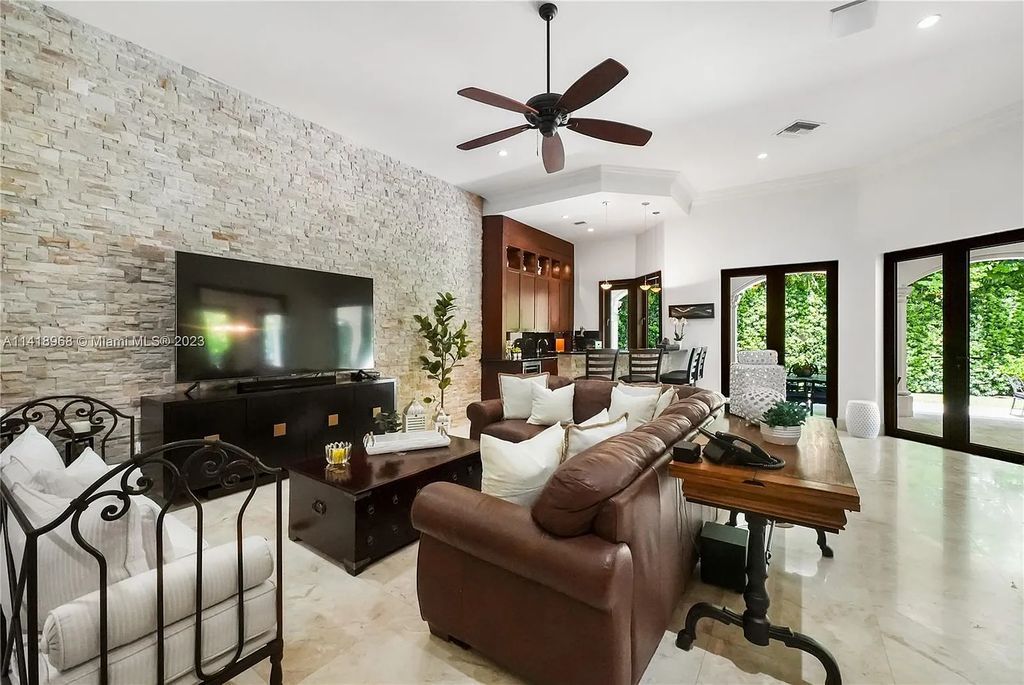 Welcome to Villa di Vista, an exquisite 6-bed, 7-bath masterpiece in  12500 Vista Lane, Pinecrest, Florida. With 7,536 sqft of luxury, high ceilings, and abundant natural light, this custom-built estate exudes charm
