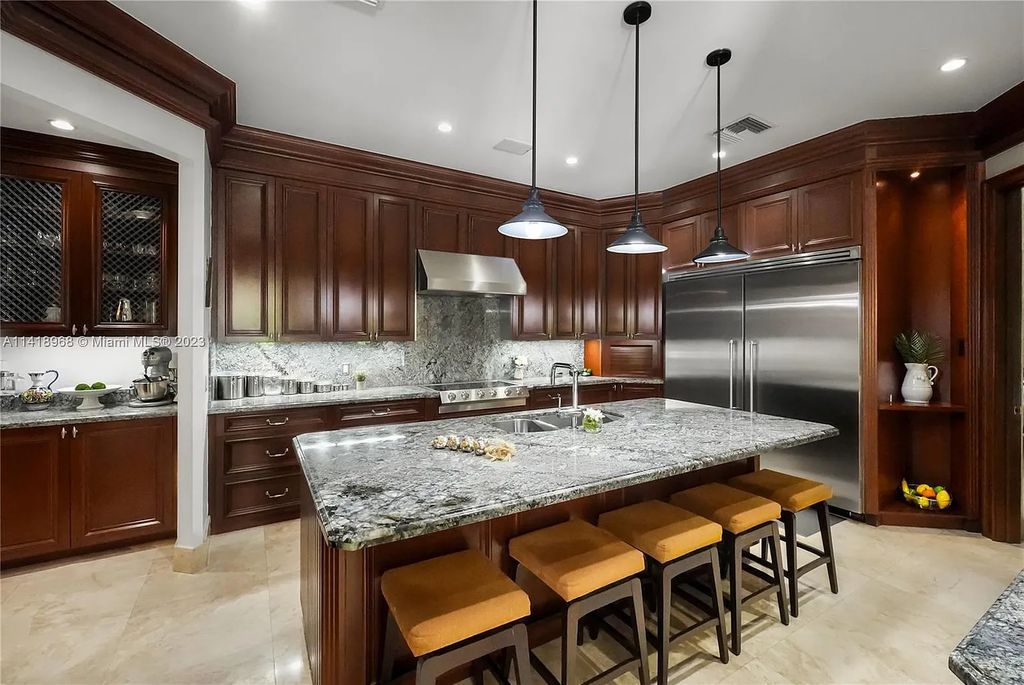 Welcome to Villa di Vista, an exquisite 6-bed, 7-bath masterpiece in  12500 Vista Lane, Pinecrest, Florida. With 7,536 sqft of luxury, high ceilings, and abundant natural light, this custom-built estate exudes charm