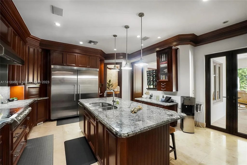 Welcome to Villa di Vista, an exquisite 6-bed, 7-bath masterpiece in  12500 Vista Lane, Pinecrest, Florida. With 7,536 sqft of luxury, high ceilings, and abundant natural light, this custom-built estate exudes charm