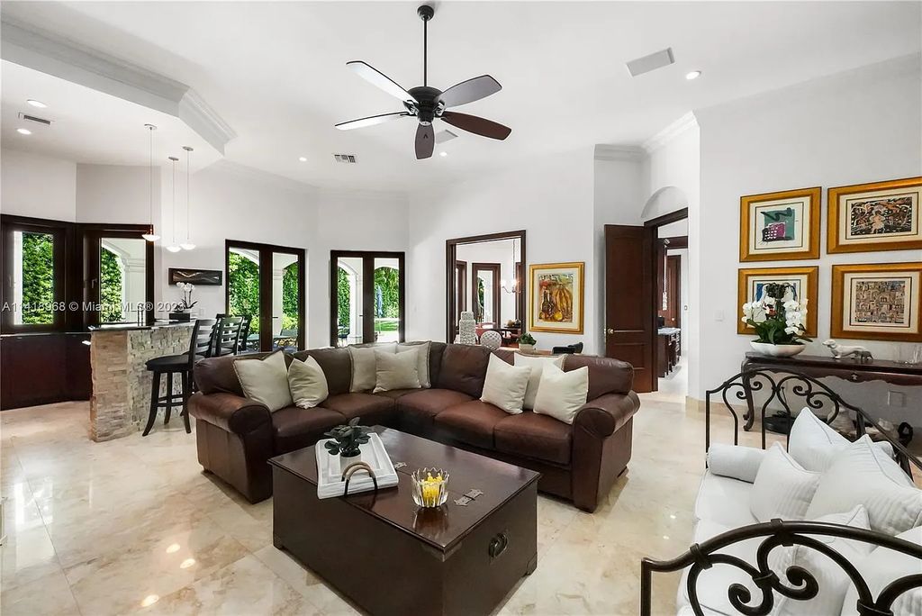 Welcome to Villa di Vista, an exquisite 6-bed, 7-bath masterpiece in  12500 Vista Lane, Pinecrest, Florida. With 7,536 sqft of luxury, high ceilings, and abundant natural light, this custom-built estate exudes charm