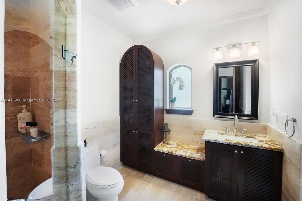 Welcome to Villa di Vista, an exquisite 6-bed, 7-bath masterpiece in  12500 Vista Lane, Pinecrest, Florida. With 7,536 sqft of luxury, high ceilings, and abundant natural light, this custom-built estate exudes charm