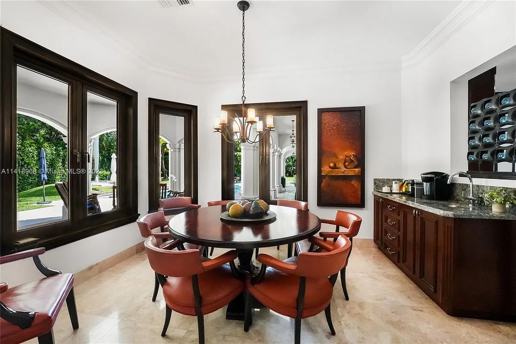 Welcome to Villa di Vista, an exquisite 6-bed, 7-bath masterpiece in  12500 Vista Lane, Pinecrest, Florida. With 7,536 sqft of luxury, high ceilings, and abundant natural light, this custom-built estate exudes charm