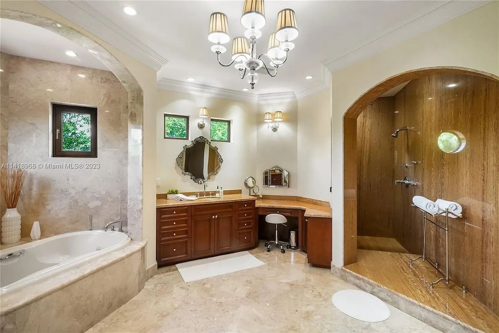 Welcome to Villa di Vista, an exquisite 6-bed, 7-bath masterpiece in  12500 Vista Lane, Pinecrest, Florida. With 7,536 sqft of luxury, high ceilings, and abundant natural light, this custom-built estate exudes charm