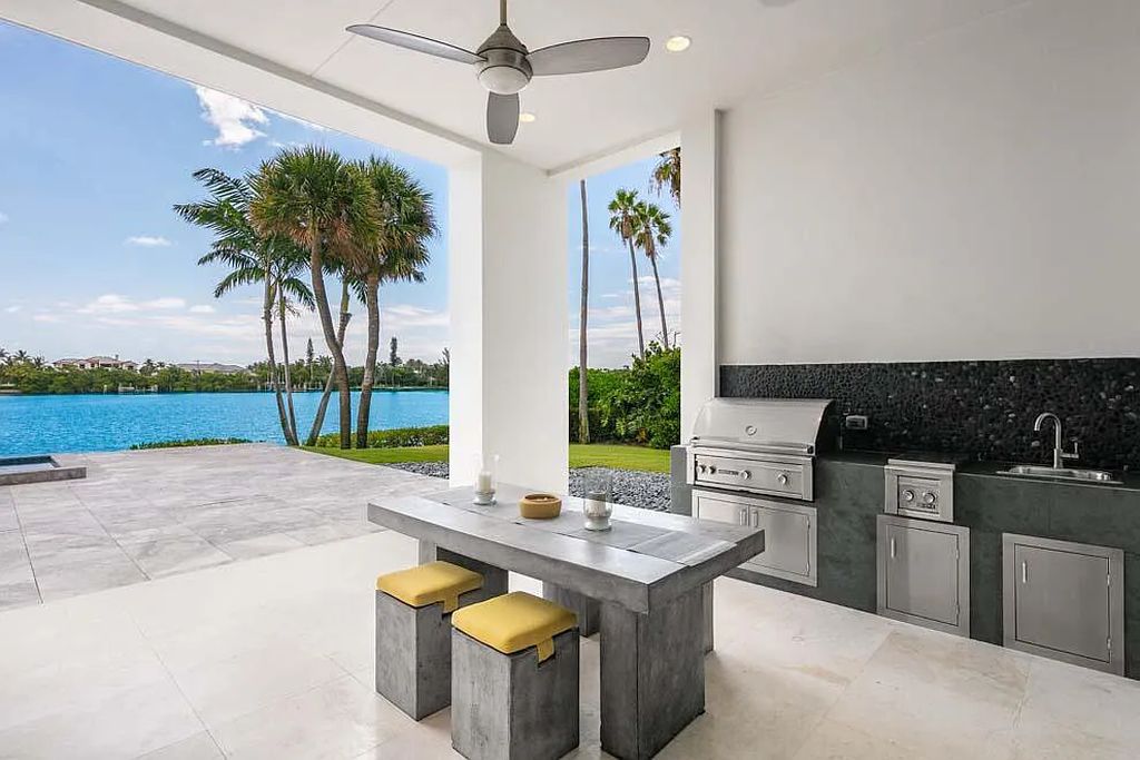 Experience the epitome of luxury living at 1540 Paslay Place, a stunning, like-new 5-bedroom estate in Manalapan, Florida.