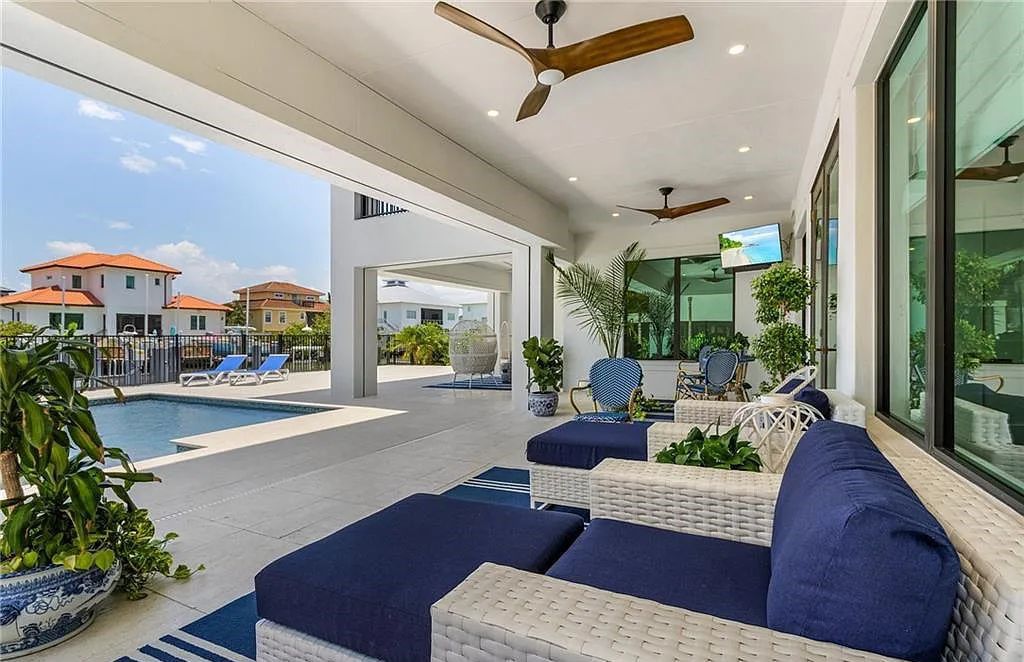 Experience the epitome of luxury living at 241 Egret Avenue, an impressive waterfront gulf access home in Naples, Florida. This newly built three-story residence boasts 5 bedrooms, 7 baths, and a wealth of upscale features.