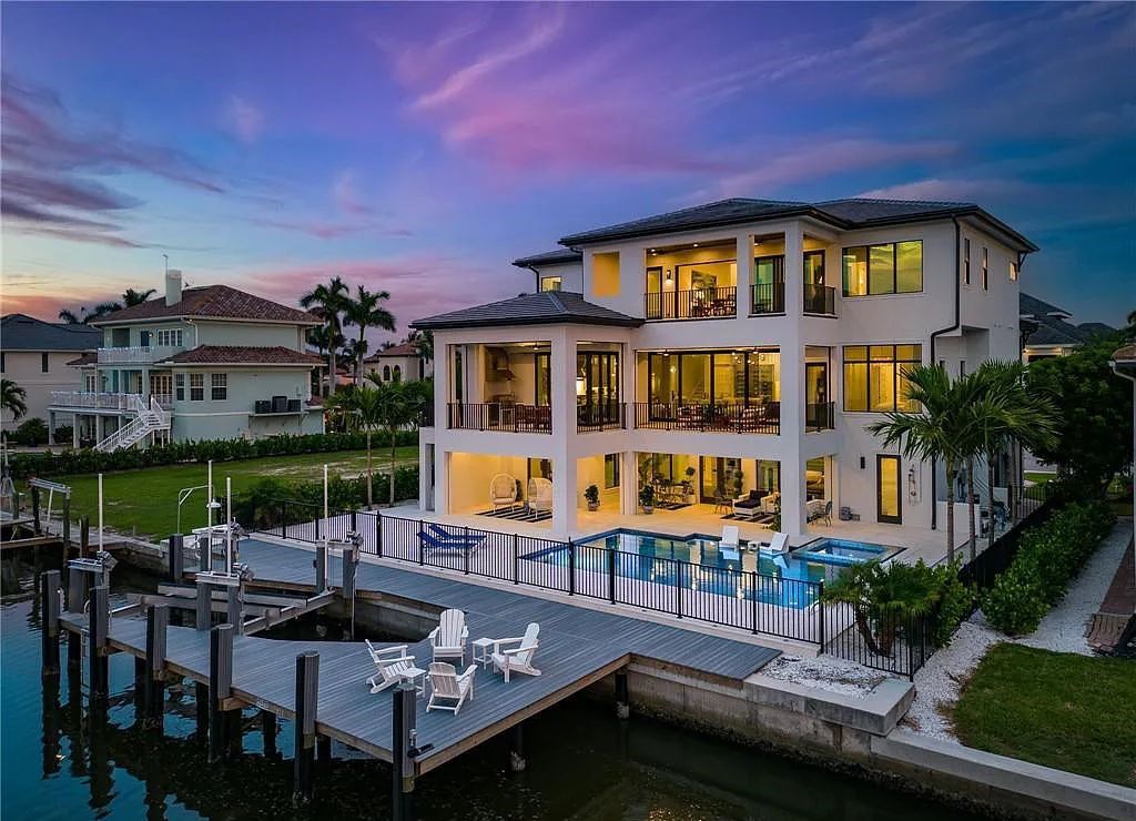 Experience the epitome of luxury living at 241 Egret Avenue, an impressive waterfront gulf access home in Naples, Florida. This newly built three-story residence boasts 5 bedrooms, 7 baths, and a wealth of upscale features.