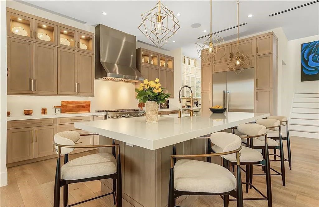 Experience the epitome of luxury living at 241 Egret Avenue, an impressive waterfront gulf access home in Naples, Florida. This newly built three-story residence boasts 5 bedrooms, 7 baths, and a wealth of upscale features.