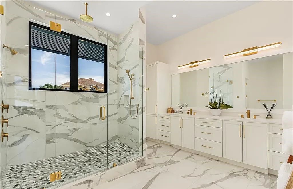 Experience the epitome of luxury living at 241 Egret Avenue, an impressive waterfront gulf access home in Naples, Florida. This newly built three-story residence boasts 5 bedrooms, 7 baths, and a wealth of upscale features.