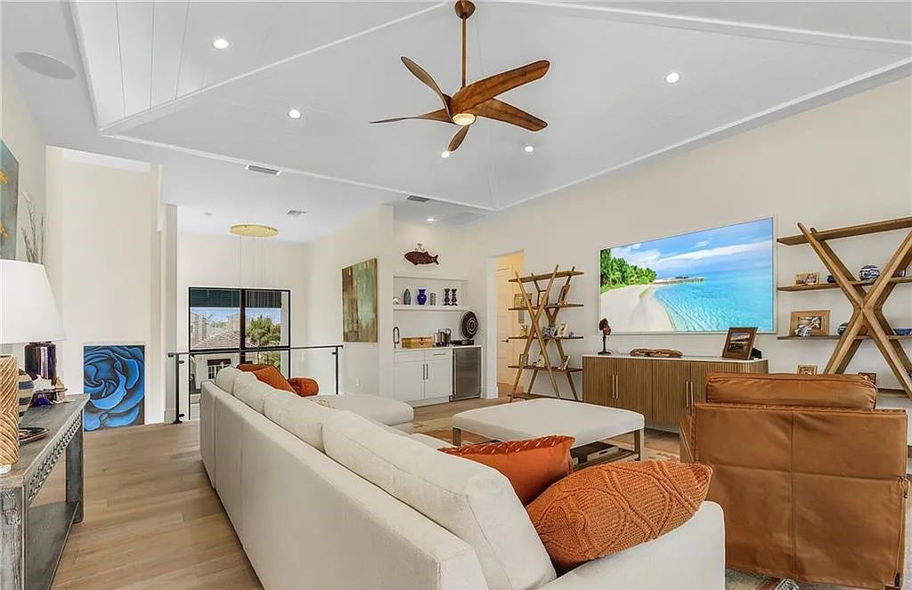 Experience the epitome of luxury living at 241 Egret Avenue, an impressive waterfront gulf access home in Naples, Florida. This newly built three-story residence boasts 5 bedrooms, 7 baths, and a wealth of upscale features.