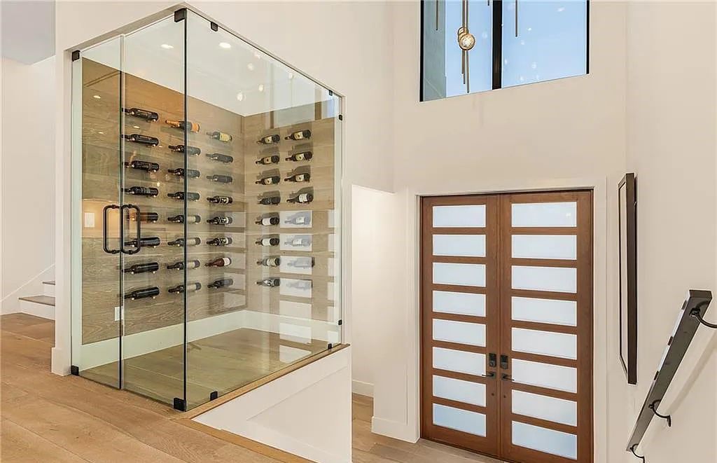 Experience the epitome of luxury living at 241 Egret Avenue, an impressive waterfront gulf access home in Naples, Florida. This newly built three-story residence boasts 5 bedrooms, 7 baths, and a wealth of upscale features.