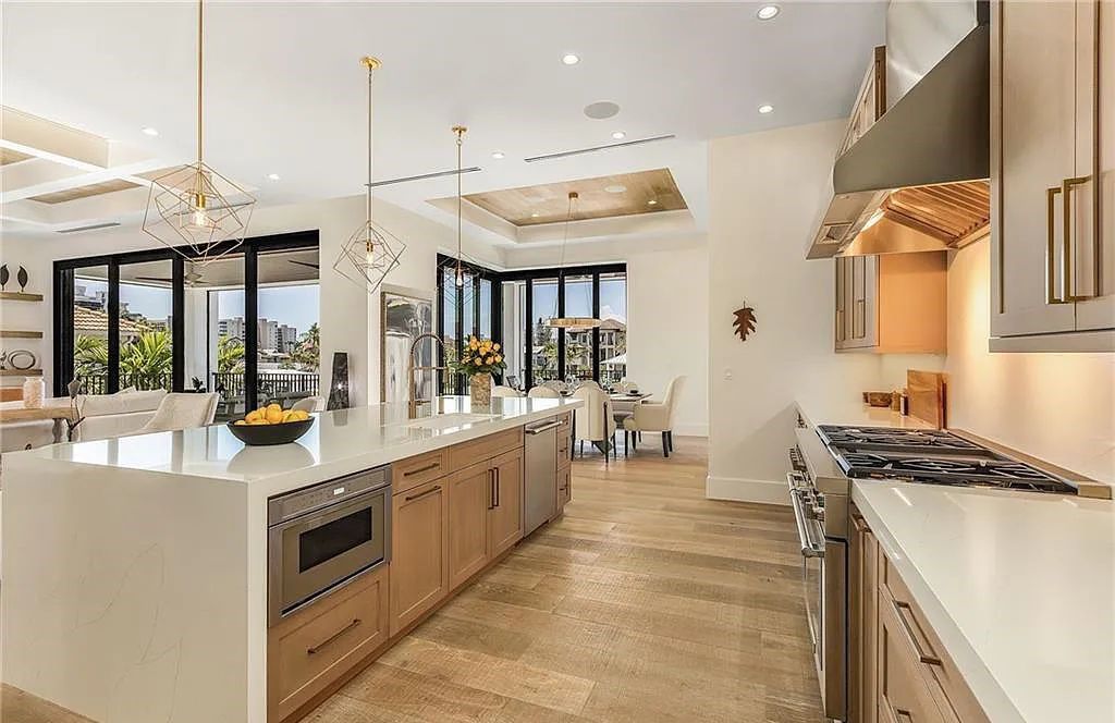 Experience the epitome of luxury living at 241 Egret Avenue, an impressive waterfront gulf access home in Naples, Florida. This newly built three-story residence boasts 5 bedrooms, 7 baths, and a wealth of upscale features.