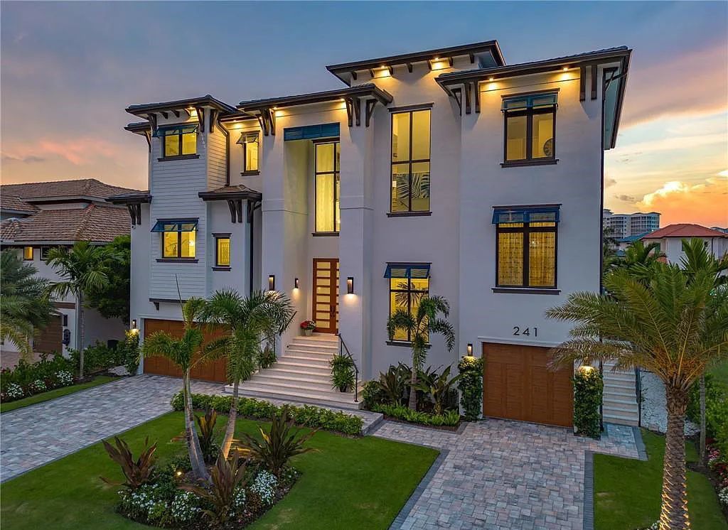 Experience the epitome of luxury living at 241 Egret Avenue, an impressive waterfront gulf access home in Naples, Florida. This newly built three-story residence boasts 5 bedrooms, 7 baths, and a wealth of upscale features.