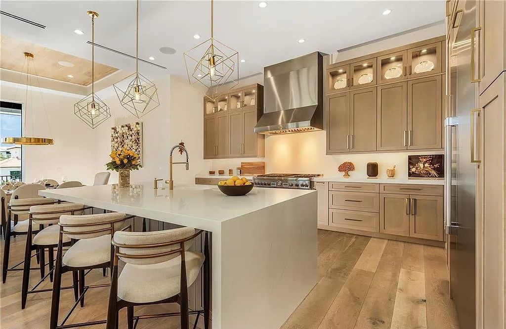 Experience the epitome of luxury living at 241 Egret Avenue, an impressive waterfront gulf access home in Naples, Florida. This newly built three-story residence boasts 5 bedrooms, 7 baths, and a wealth of upscale features.