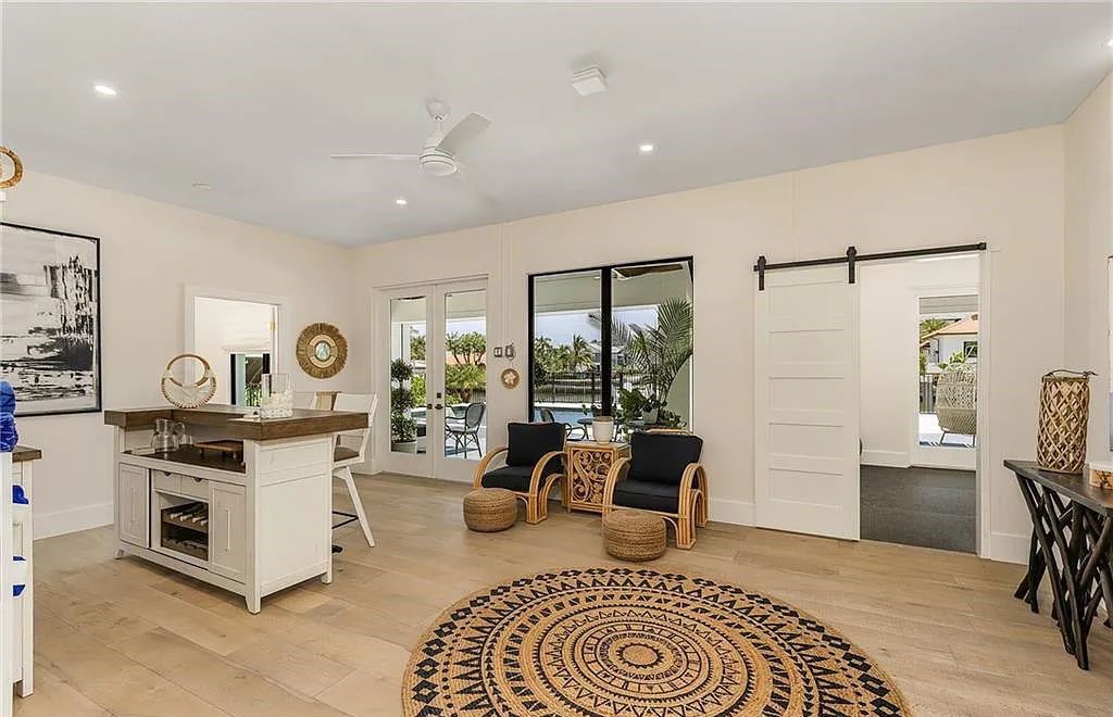 Experience the epitome of luxury living at 241 Egret Avenue, an impressive waterfront gulf access home in Naples, Florida. This newly built three-story residence boasts 5 bedrooms, 7 baths, and a wealth of upscale features.