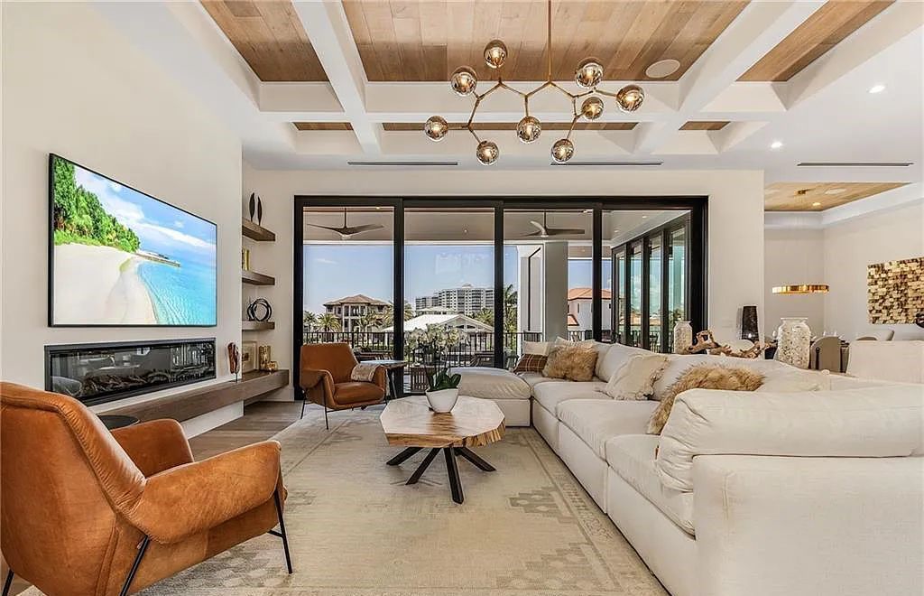 Experience the epitome of luxury living at 241 Egret Avenue, an impressive waterfront gulf access home in Naples, Florida. This newly built three-story residence boasts 5 bedrooms, 7 baths, and a wealth of upscale features.