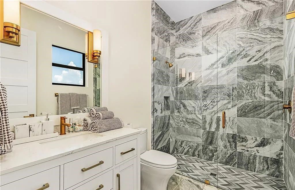 Experience the epitome of luxury living at 241 Egret Avenue, an impressive waterfront gulf access home in Naples, Florida. This newly built three-story residence boasts 5 bedrooms, 7 baths, and a wealth of upscale features.