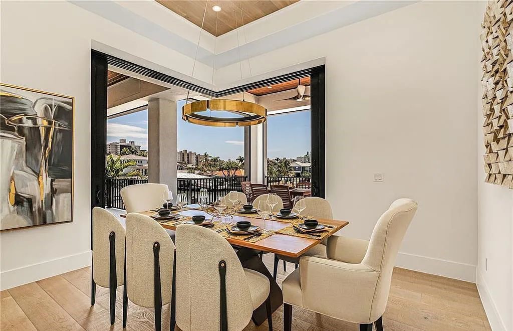 Experience the epitome of luxury living at 241 Egret Avenue, an impressive waterfront gulf access home in Naples, Florida. This newly built three-story residence boasts 5 bedrooms, 7 baths, and a wealth of upscale features.