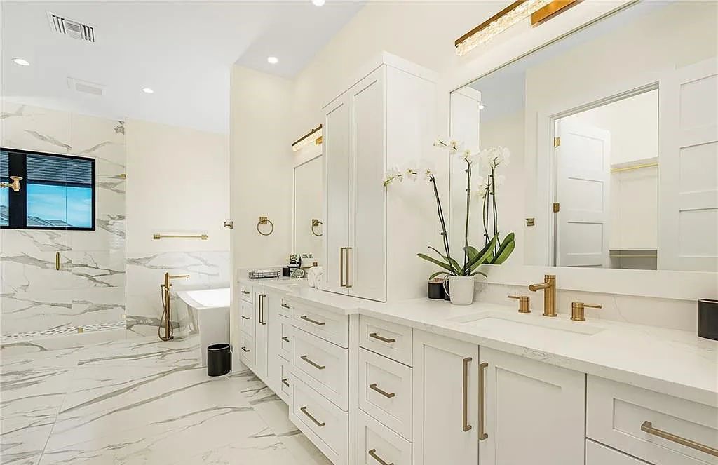 Experience the epitome of luxury living at 241 Egret Avenue, an impressive waterfront gulf access home in Naples, Florida. This newly built three-story residence boasts 5 bedrooms, 7 baths, and a wealth of upscale features.