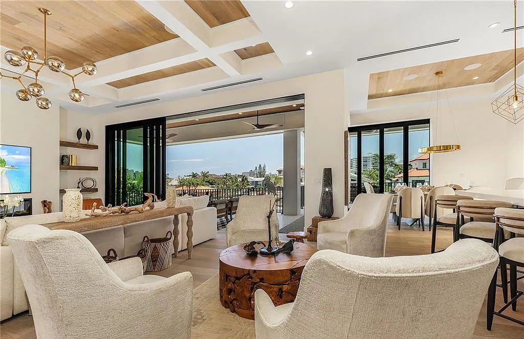 Experience the epitome of luxury living at 241 Egret Avenue, an impressive waterfront gulf access home in Naples, Florida. This newly built three-story residence boasts 5 bedrooms, 7 baths, and a wealth of upscale features.