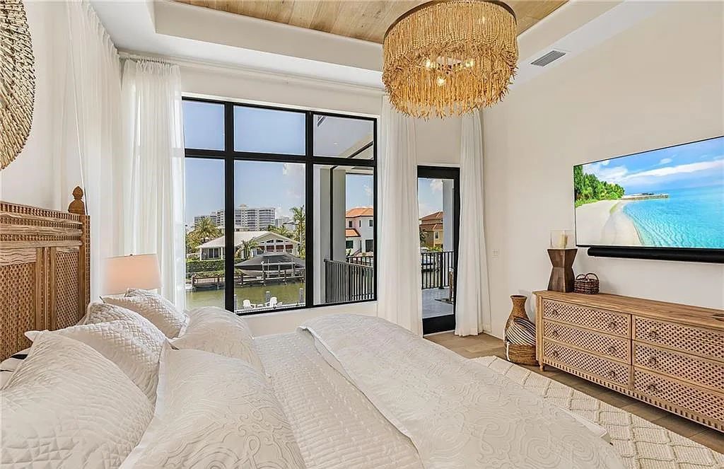 Experience the epitome of luxury living at 241 Egret Avenue, an impressive waterfront gulf access home in Naples, Florida. This newly built three-story residence boasts 5 bedrooms, 7 baths, and a wealth of upscale features.